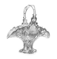 An American Silver Basket, Reed & Barton, Taunton, MA, having an openwork vine and volute decorated body and handle with an S-scroll de