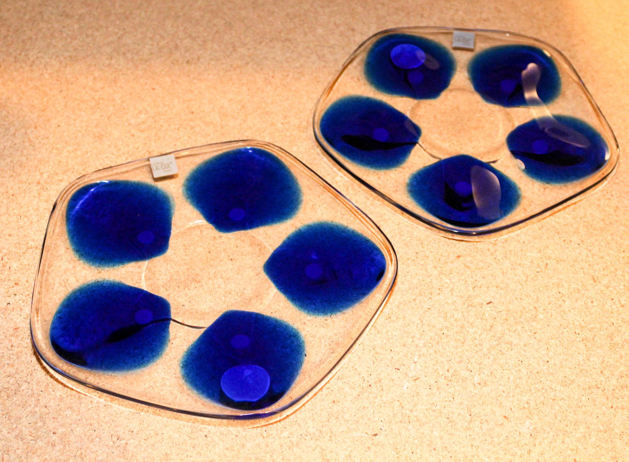 Two Lalique Oyster Plates. Width 8 inches.