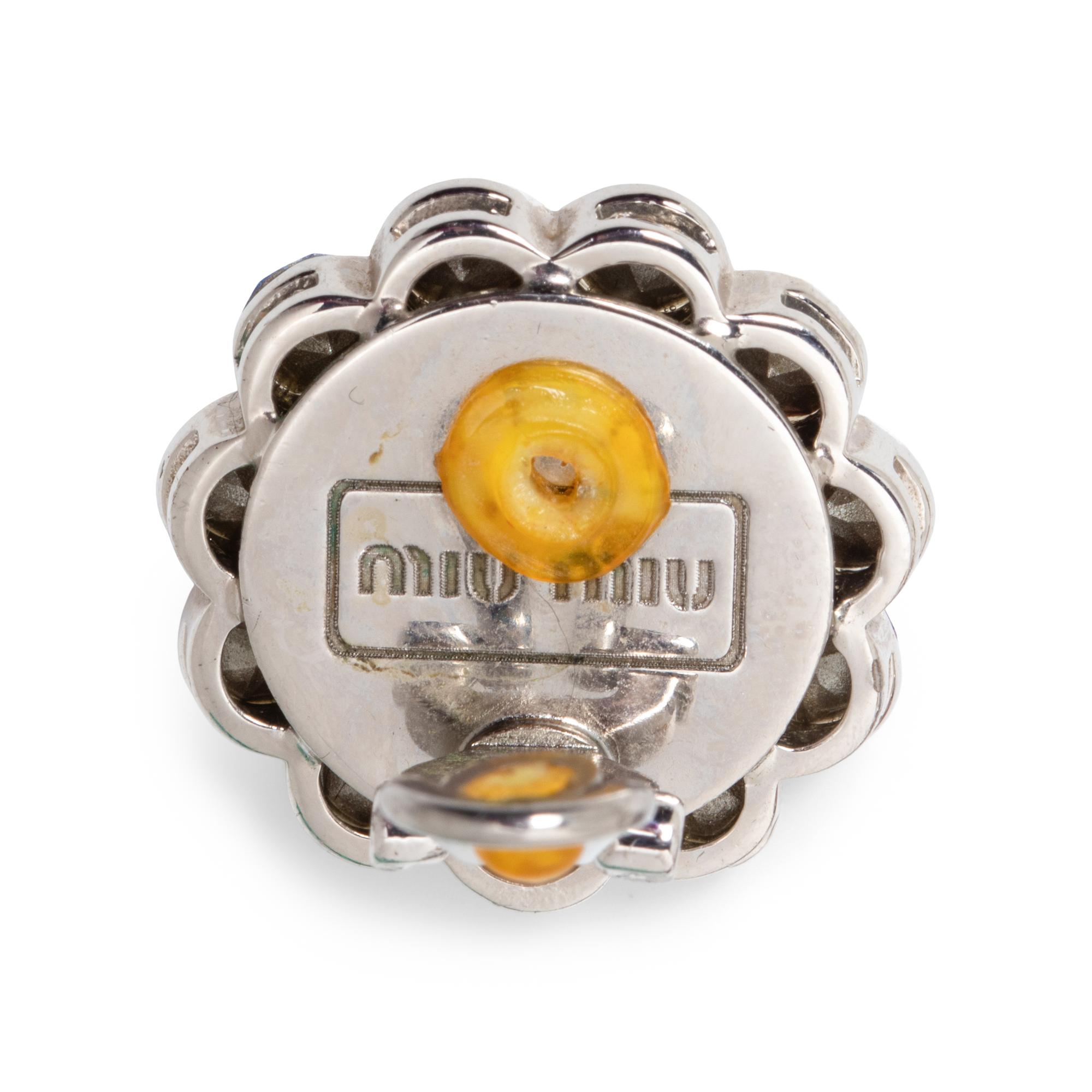 PRADA & MIU MIU, THREE BROOCHES & TWO PAIRS OF EAR CLIPS