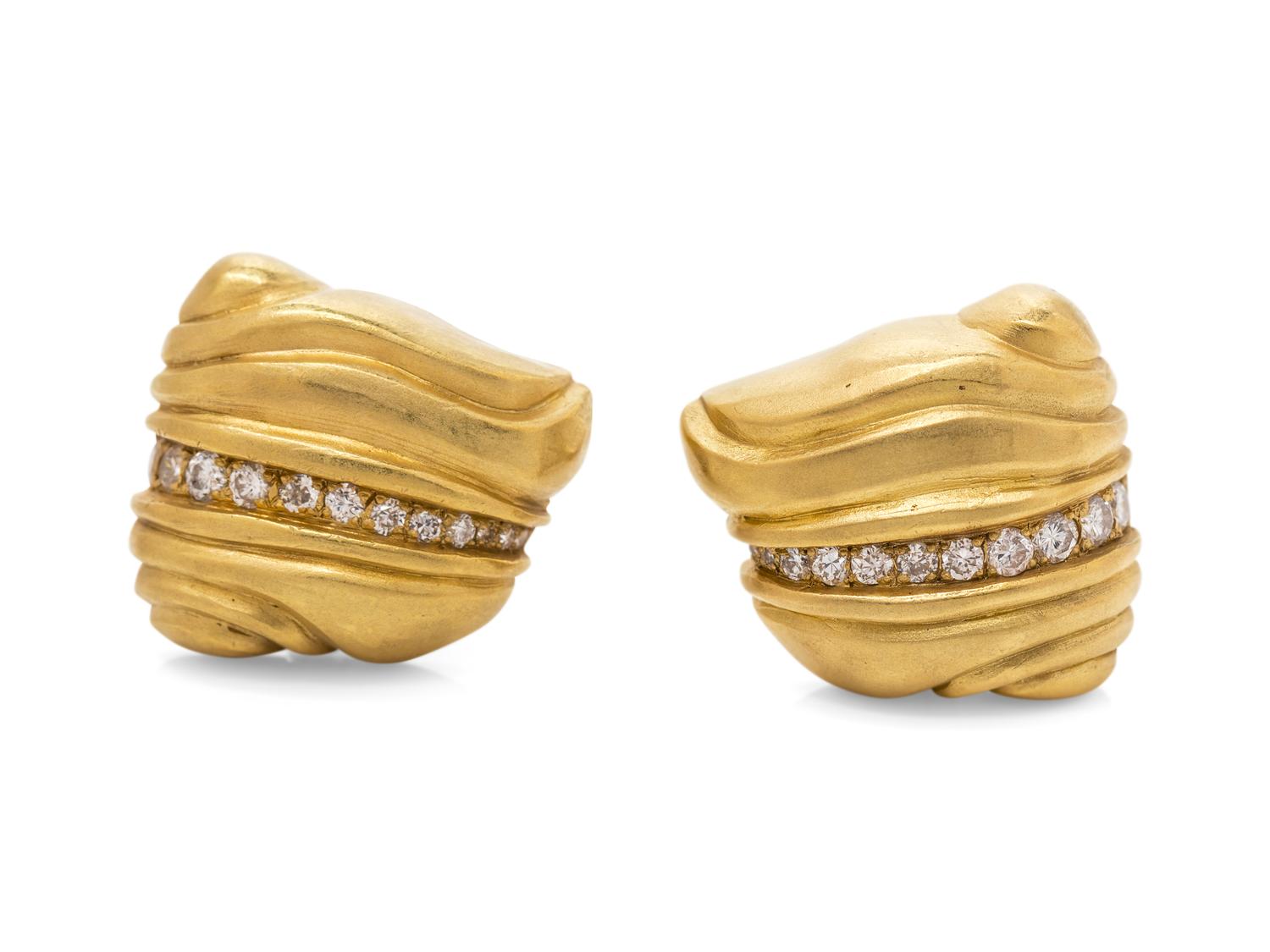 A Pair of 18 Karat Yellow Gold and Diamond Earclips,