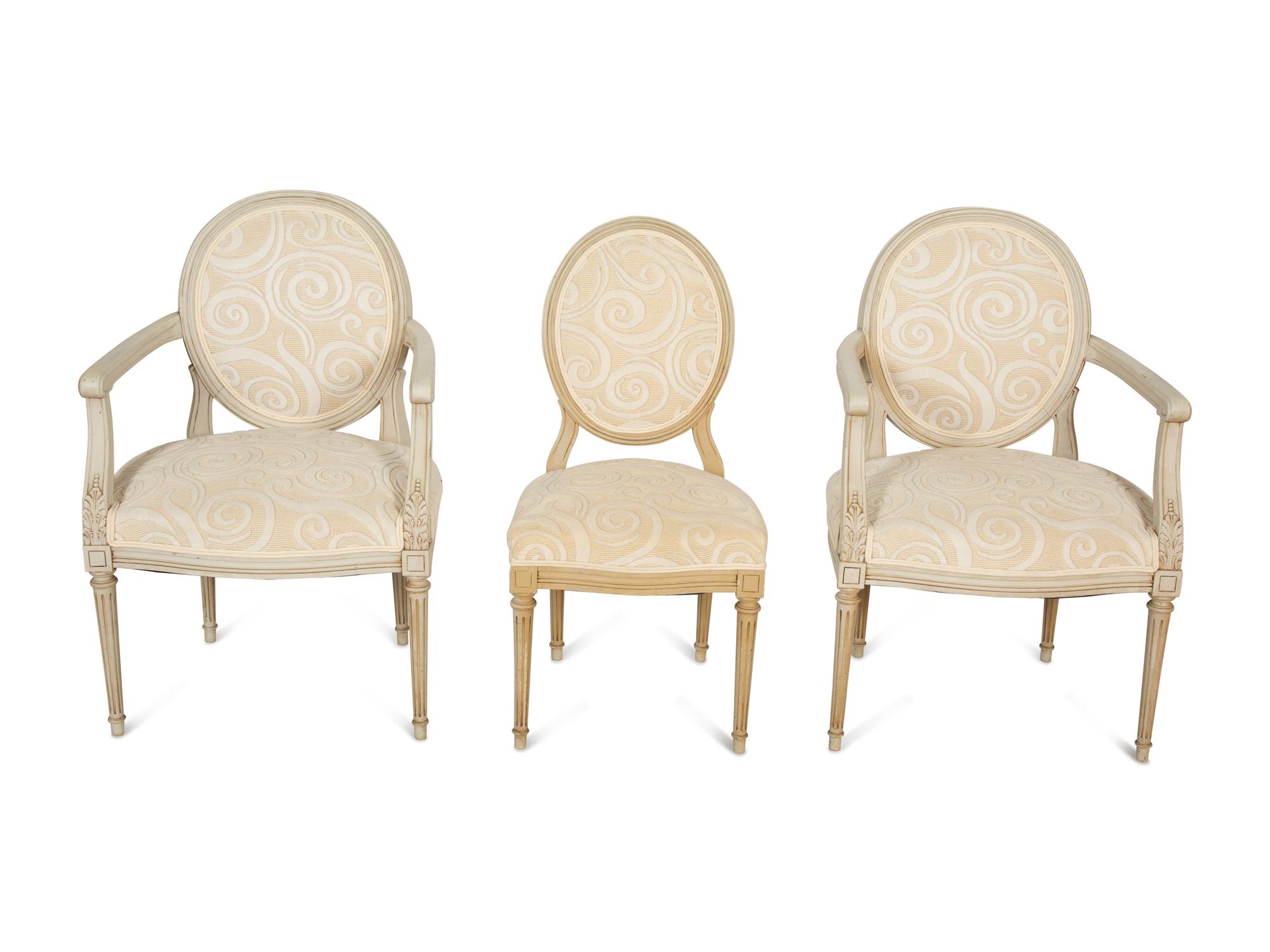 A Pair of Louis XVI Style Oval Back Painted Fauteuils and Matching Side Chair