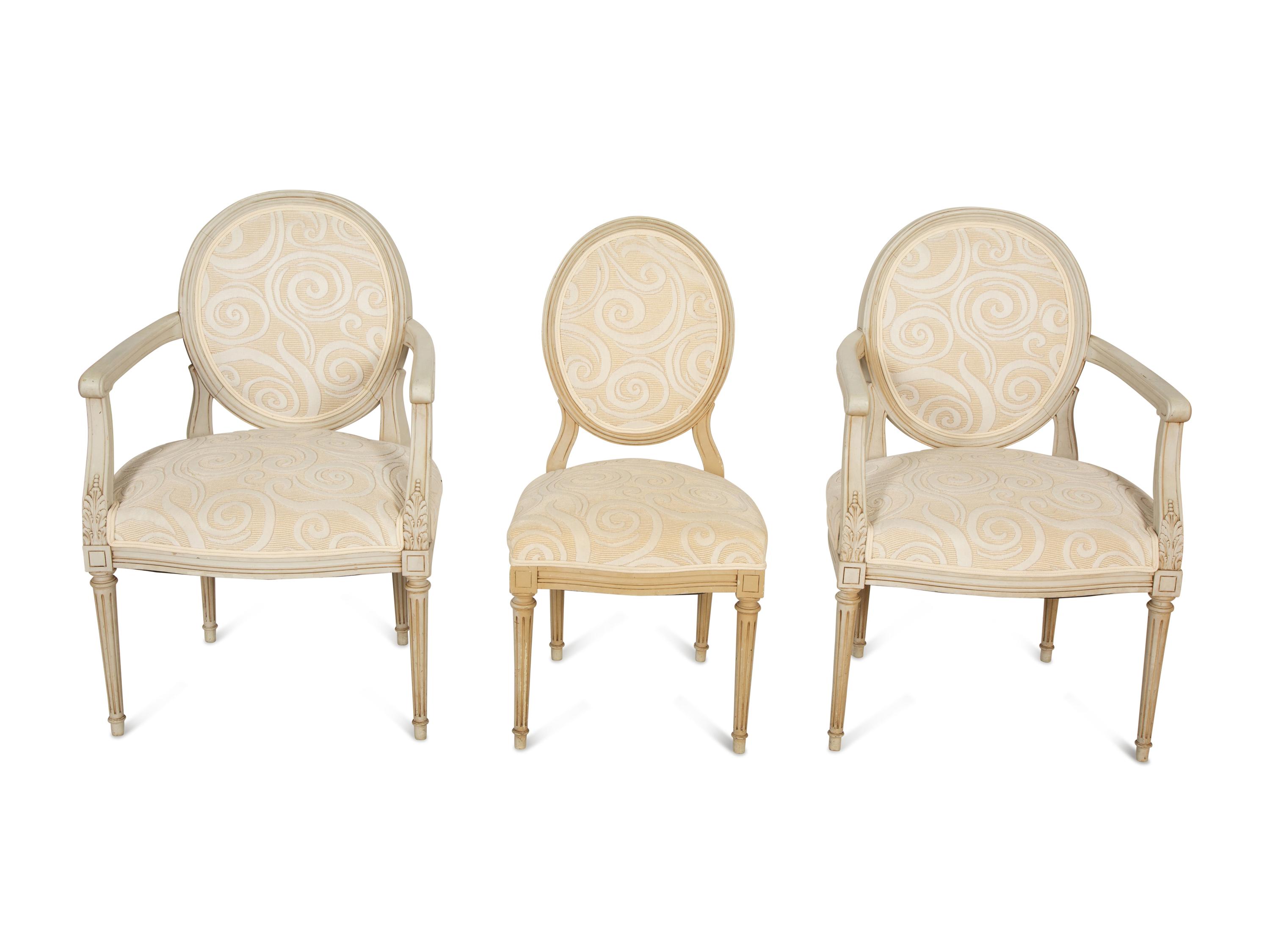 A Pair of Louis XVI Style Oval Back Painted Fauteuils and Matching Side Chair