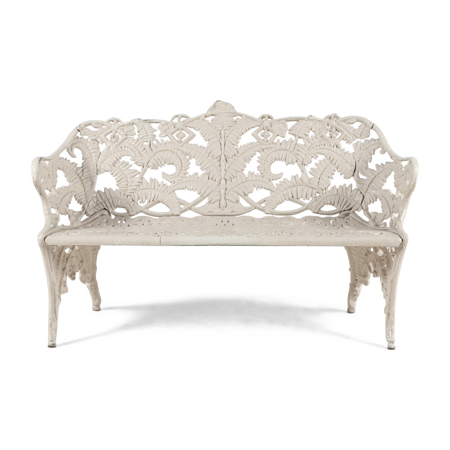 A Four-Piece Cast Iron Garden Seating Suite