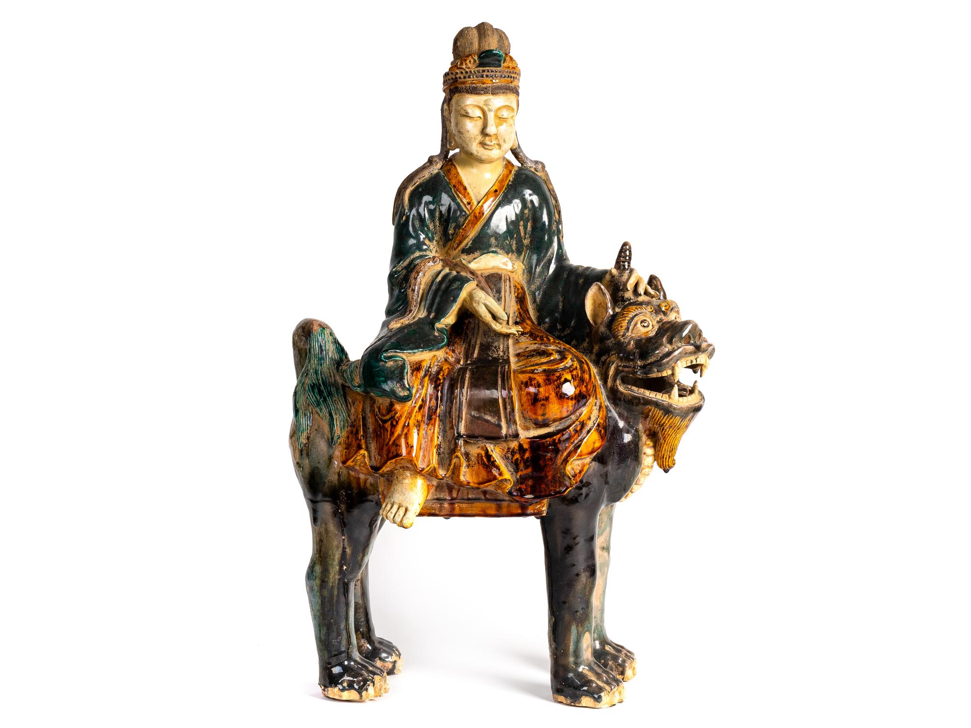 A Chinese Sancai Glazed Pottery Figure of an Immortal Riding a Mythical Beast — POSSIBLY 18TH CENTURY