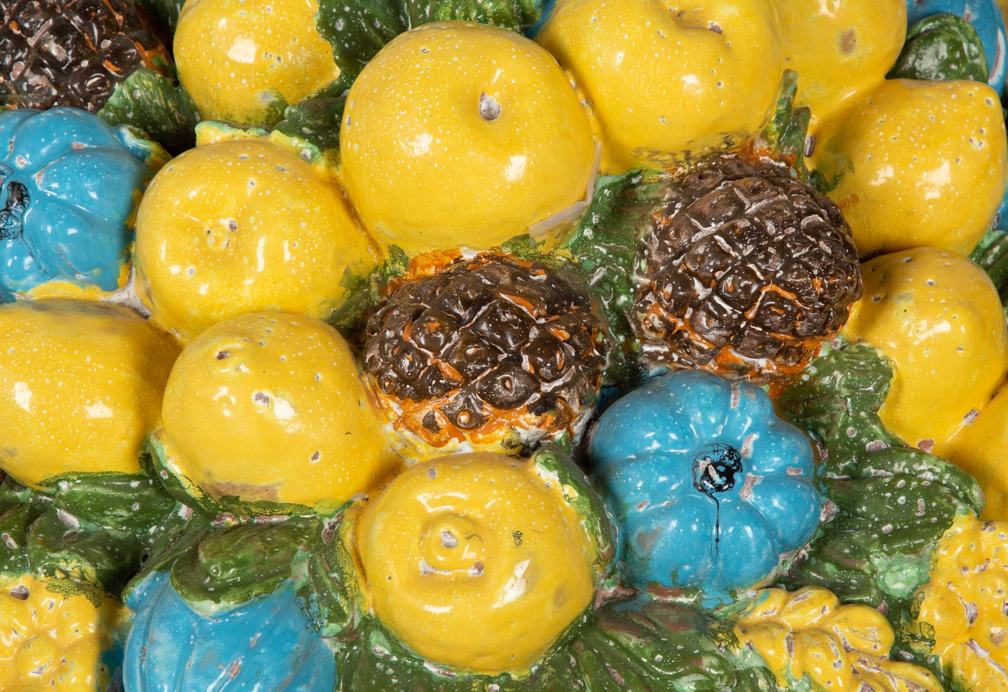 A Large Italian Glazed Terra Cotta Model of a Fruit-Filled Urn with Snails and Frogs
