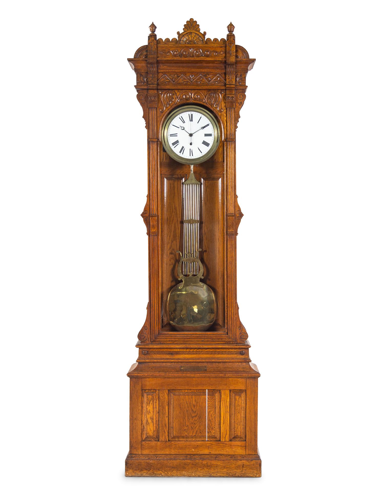A Victorian Carved Oak Tall Case Clock