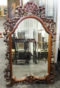 A Victorian Style Mahogany Carved Mirror. Height 53 x width 35 inches.