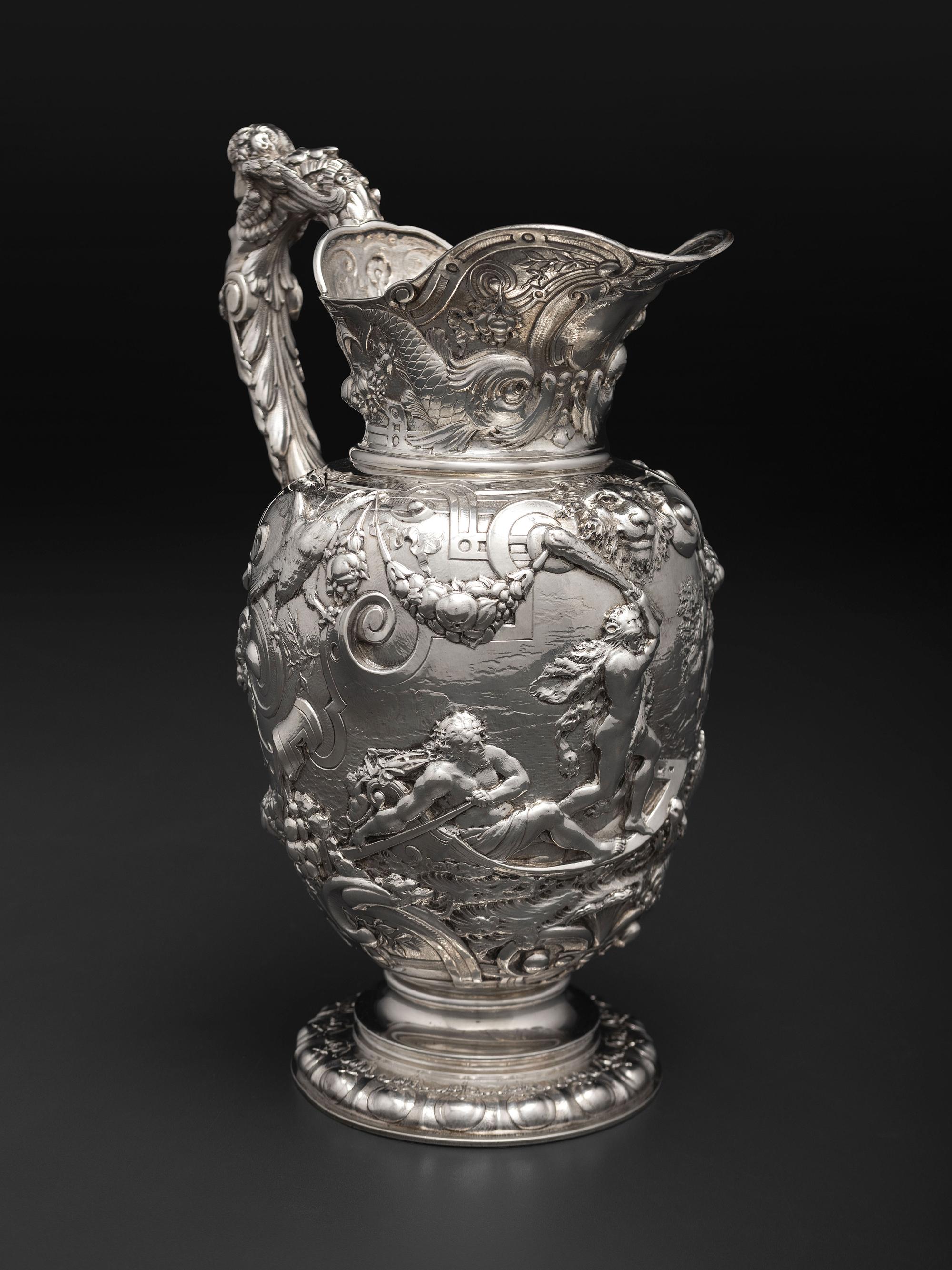 An American Baroque Style Repousse Silver Pitcher