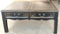 A Table with Leather Inset Top Height 16 1/2 x width 35 x depth 19 inches.