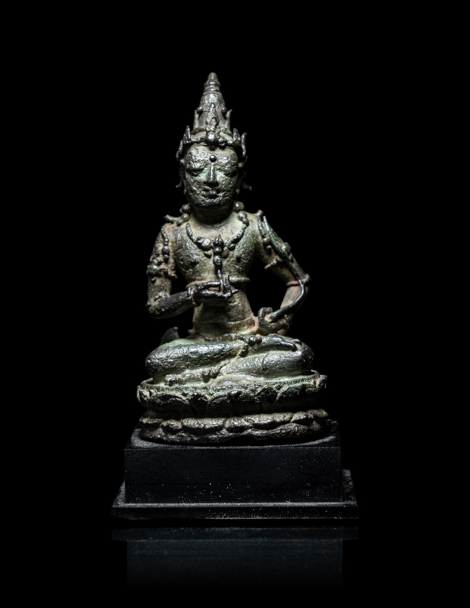 A Small Indonesian Bronze Figure of a Female Retinue