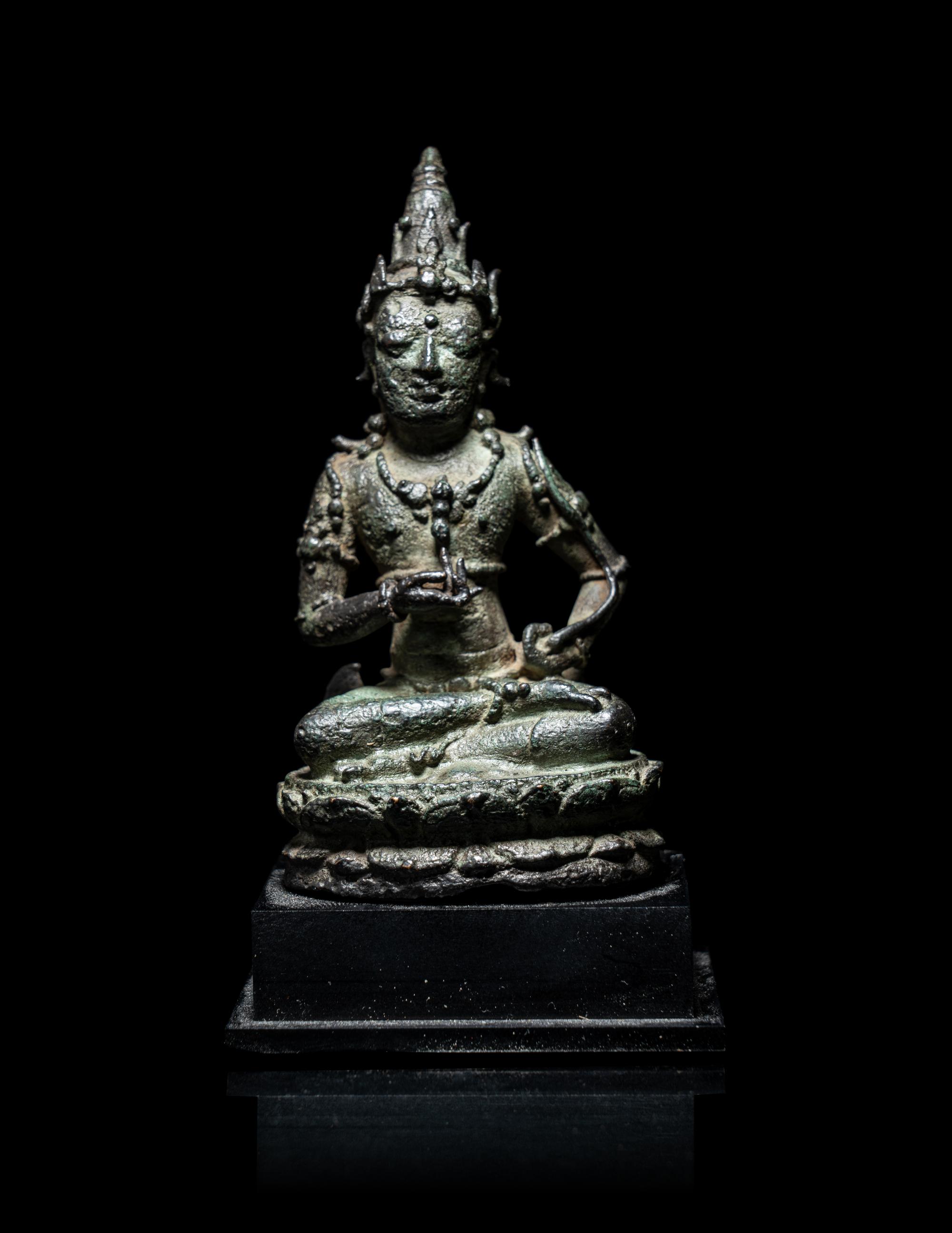 A Small Indonesian Bronze Figure of a Female Retinue