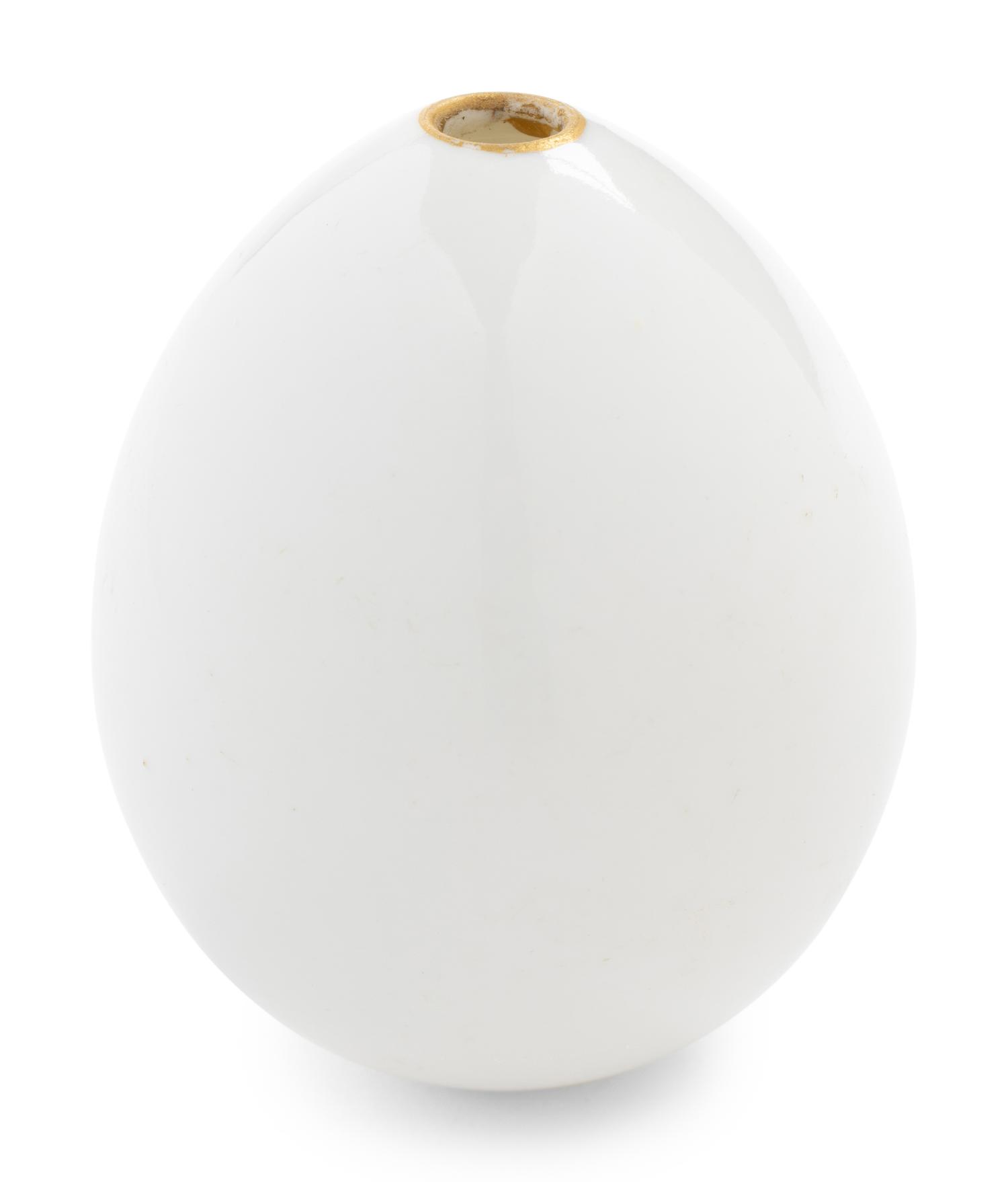 A Nicholas II Imperial Porcelain Factory Parcel-Gilt Porcelain Easter Egg