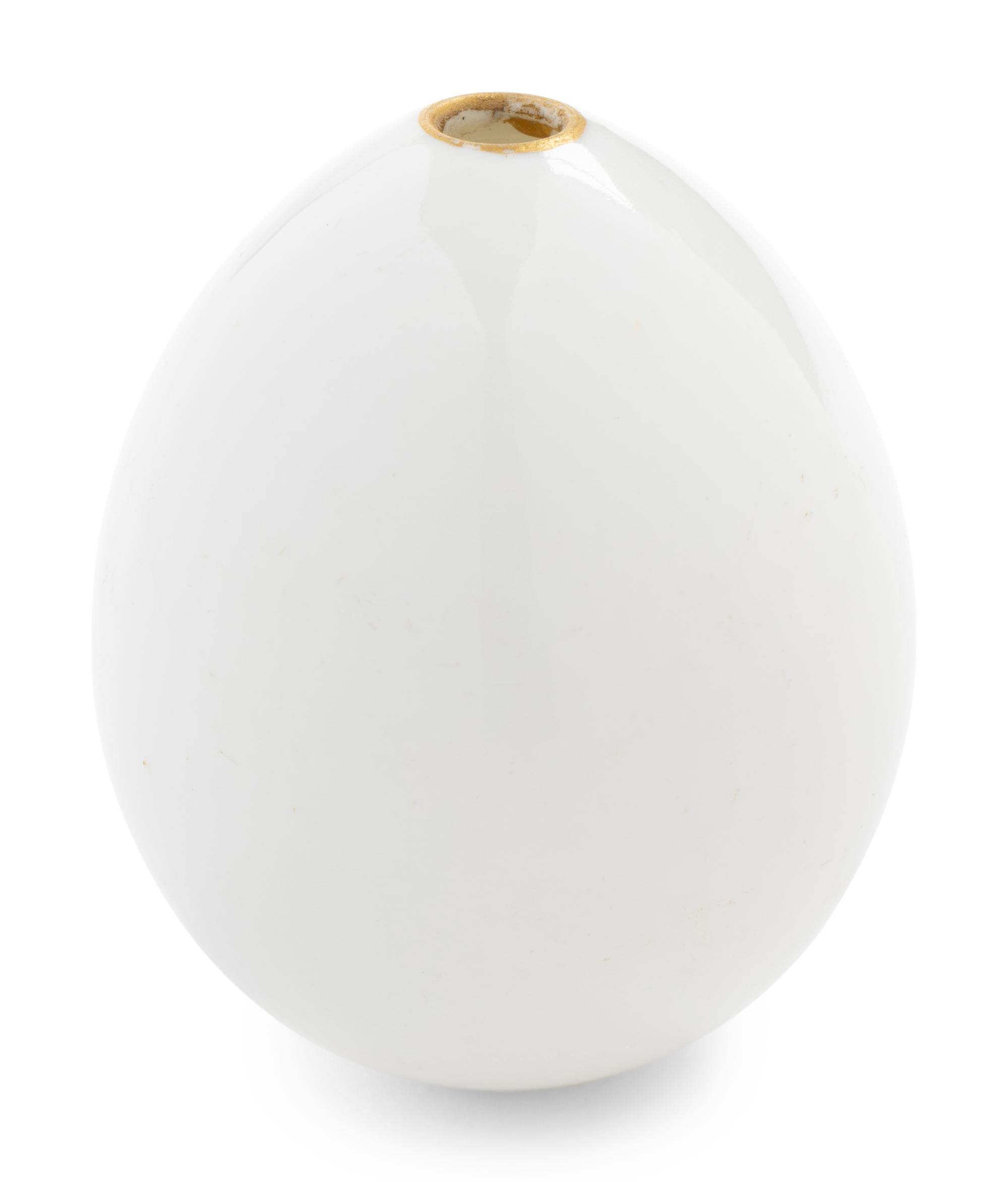 A Nicholas II Imperial Porcelain Factory Parcel-Gilt Porcelain Easter Egg