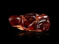 A Carved Amber Hand Citron-Form Snuff Bottle