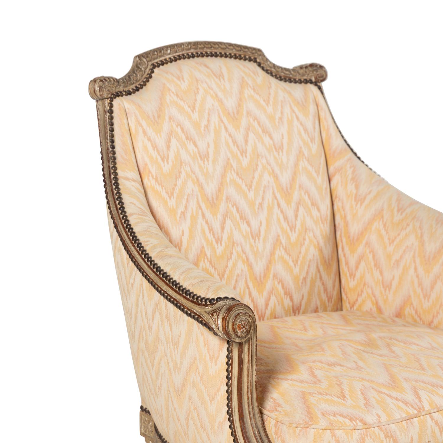 A Pair of Louis XVI Style Carved and Grey-Painted Bergères