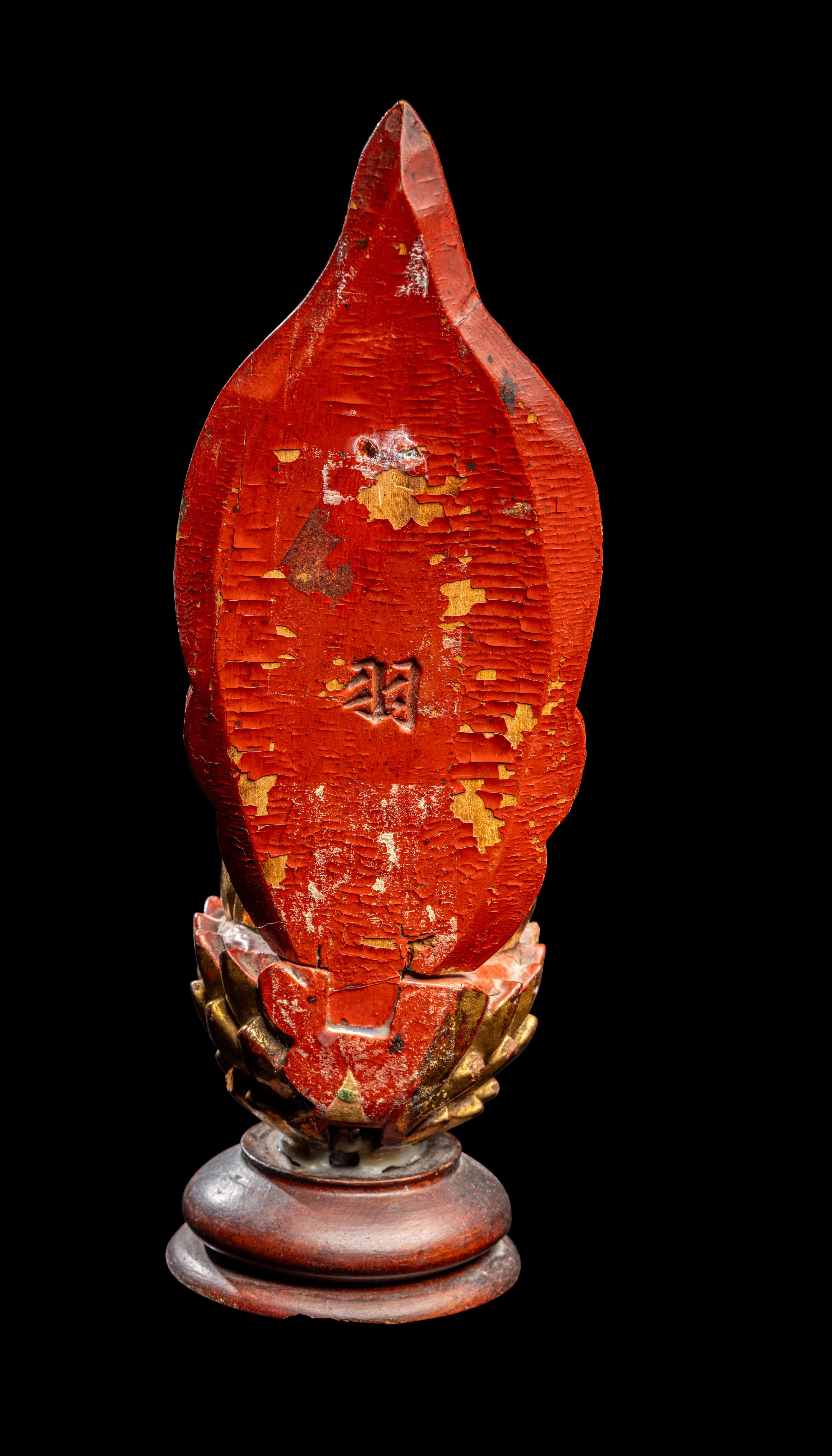 A Gilt and Red Lacquered Wood Figure of Buddha
