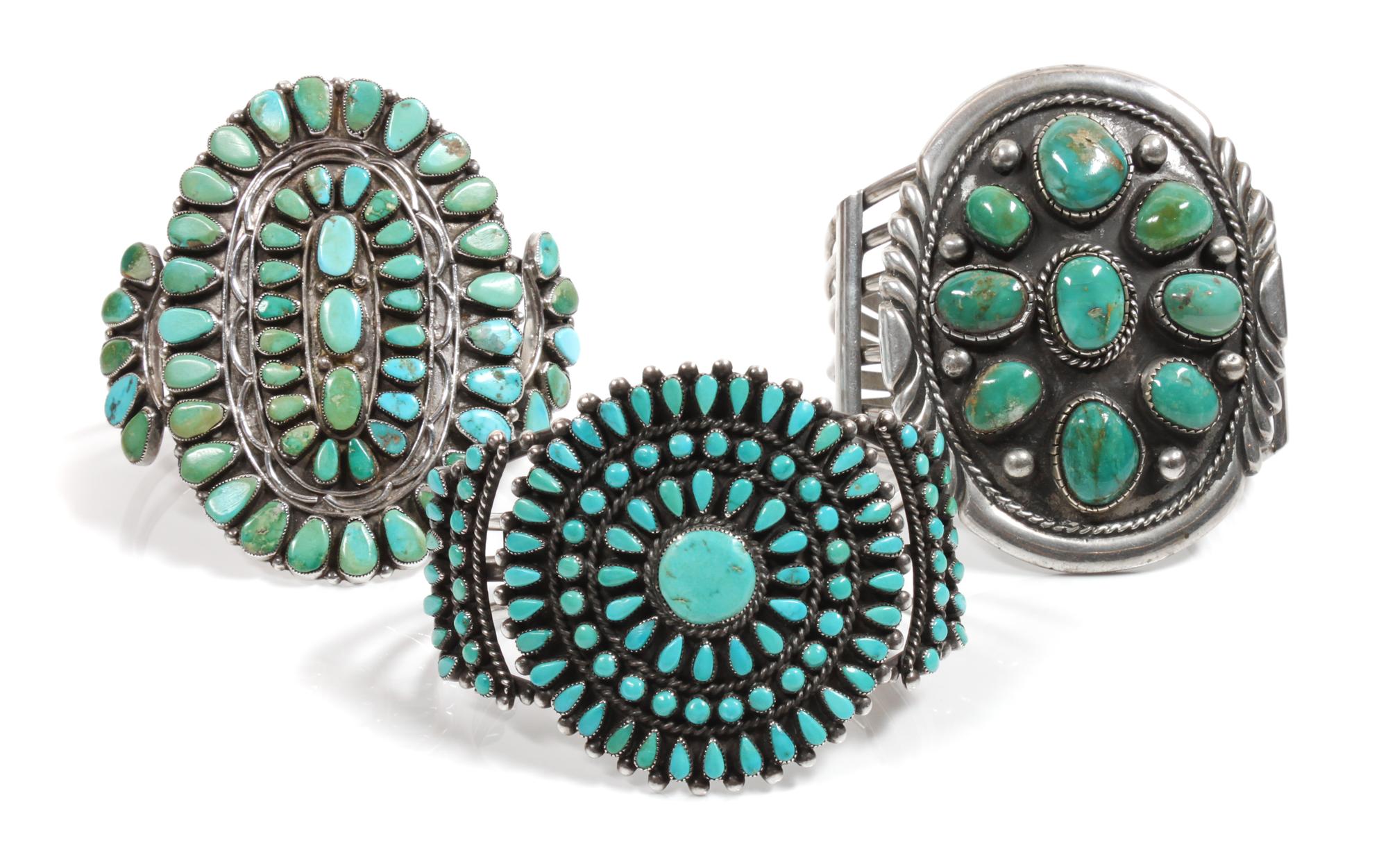 Three Southwestern Silver and Turquoise Cluster Bracelets Length of one 5 3/4 x opening 1 1/4 x width 3 inches