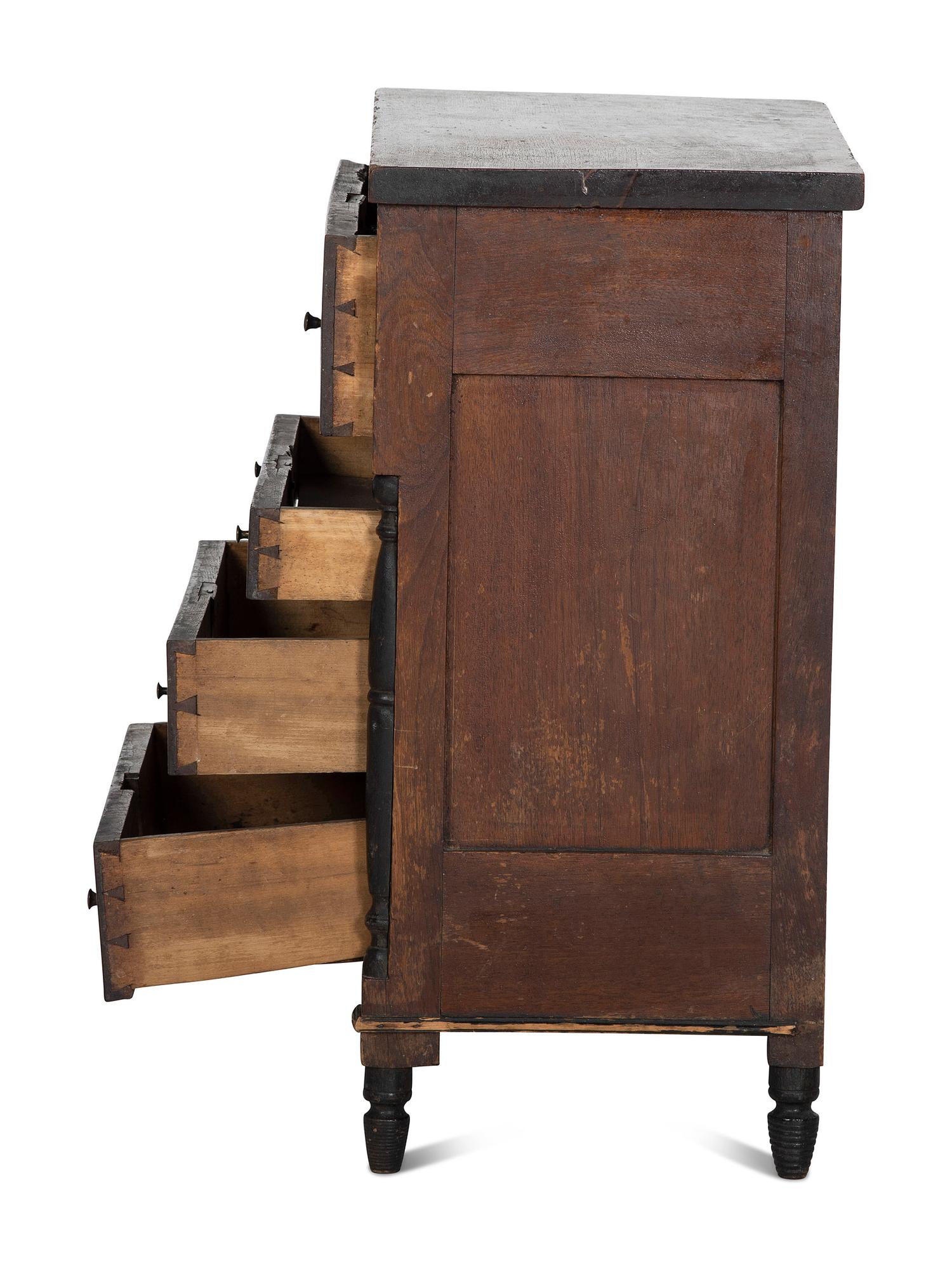 A Late Federal Parcel Ebonized Walnut Diminutive Child's Chest of Drawers