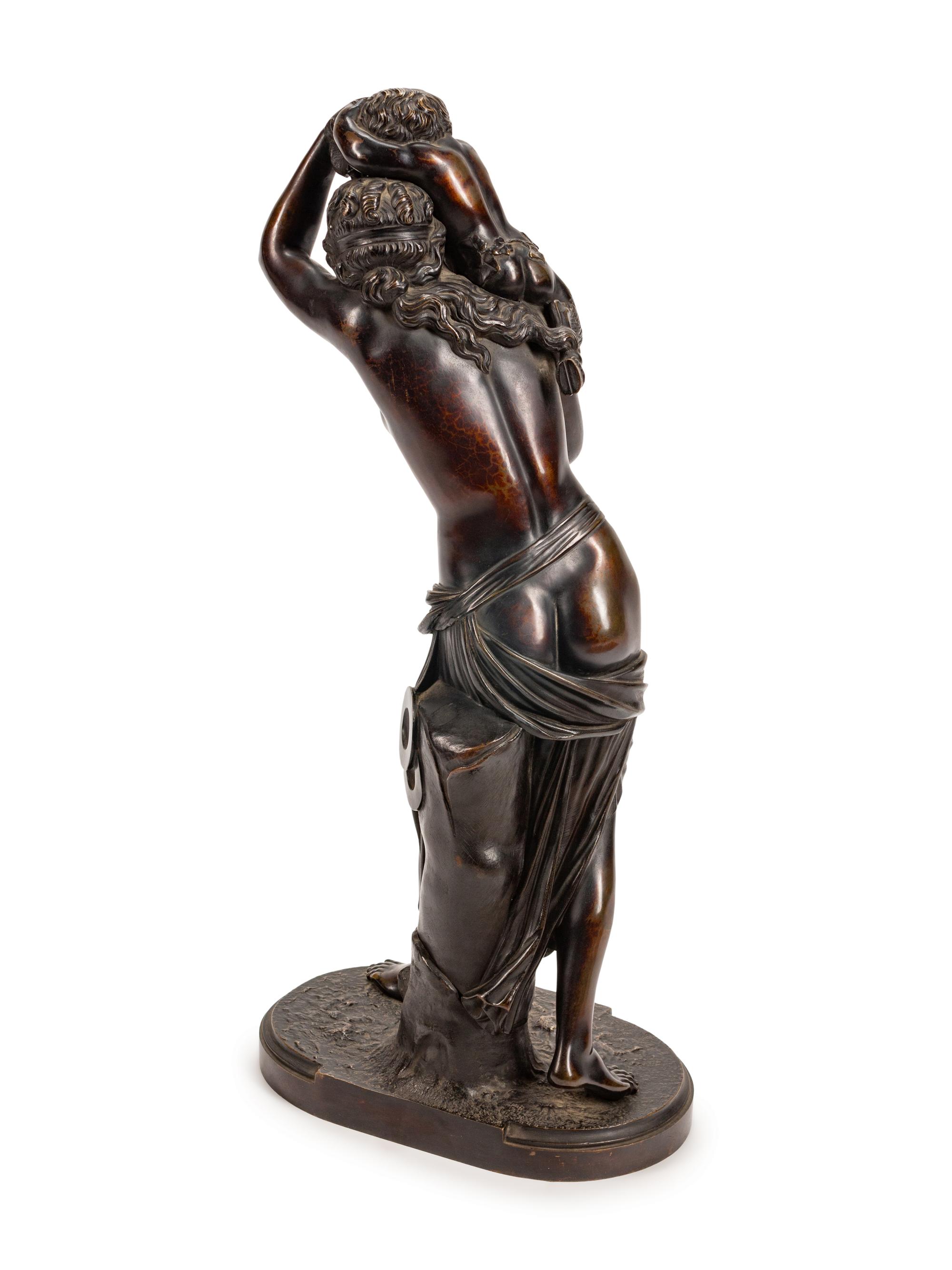A French Patinated Bronze Group of a Maiden and Infant Satyr