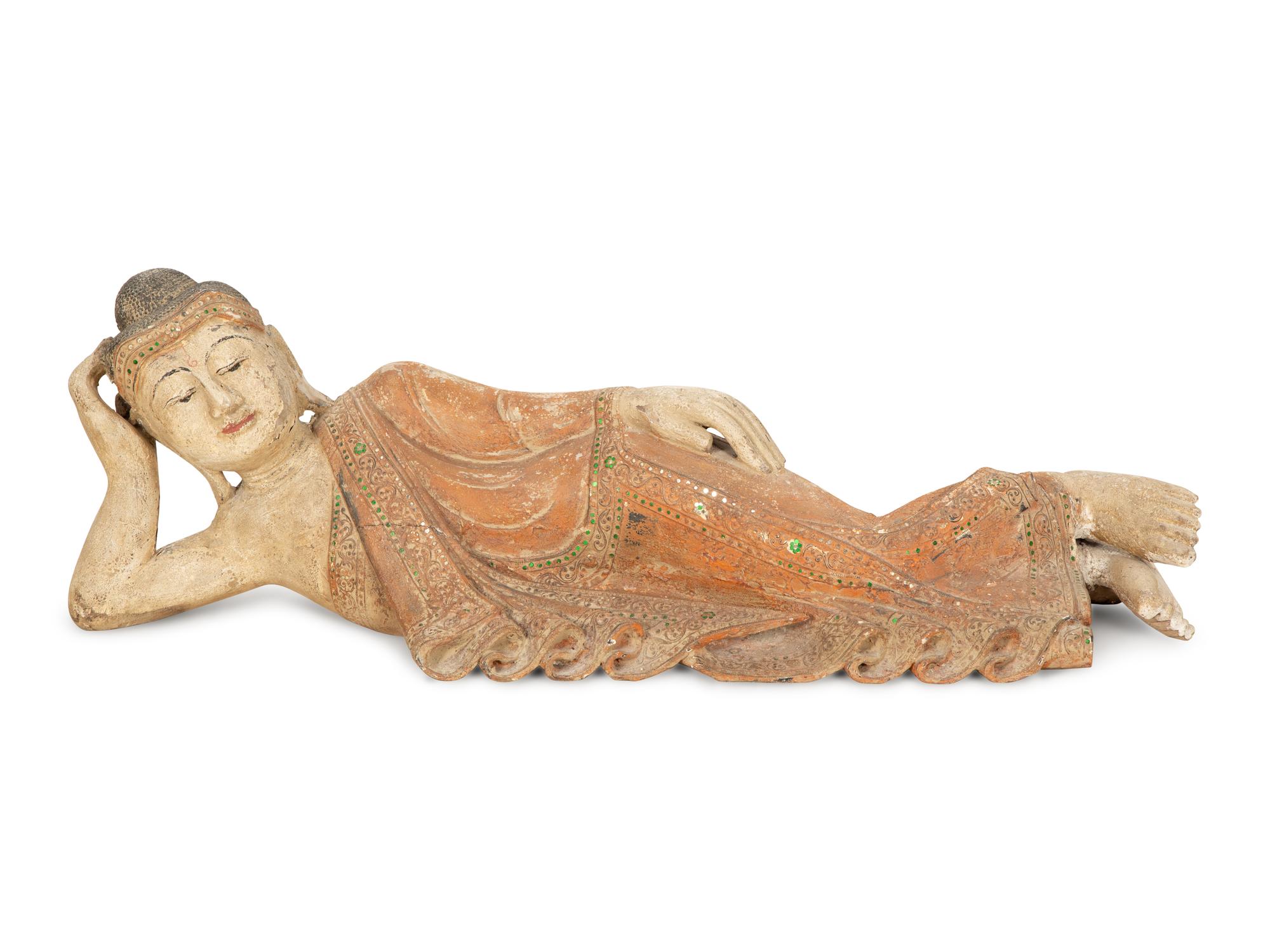 A South-East Asian Carved and Painted Wood Sculpture of a Reclining Buddha — 19th/20th Century