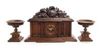 A Black Forest Style Carved Wood Clock Garniture Height overall 15 inches. — LATE 19TH CENTURY