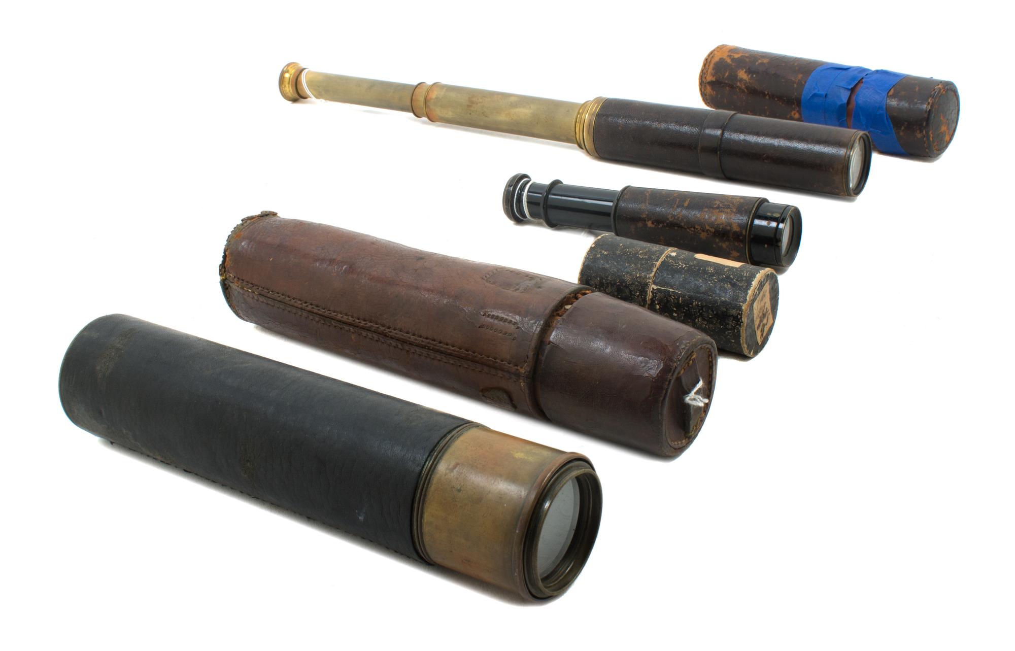 A Group of Four Leather Body Hand Telescopes Length of first 10 1/4 inches.