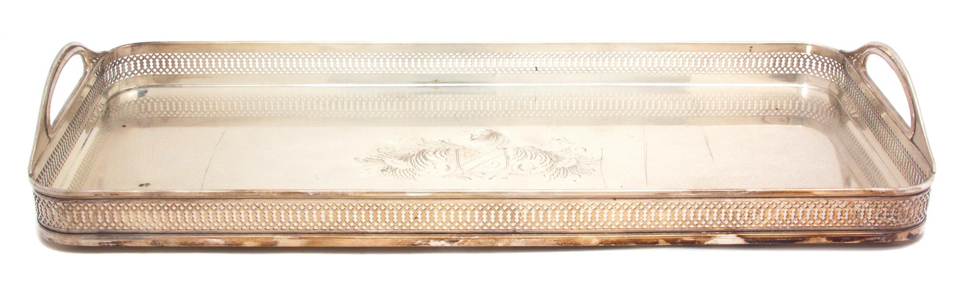 A Silver Plate Galleried Two Handle Serving Tray, , having a pierced gallery with two cut-out handles; with engraved armorial.