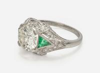 A Platinum, Diamond, and Emerald Art Deco Ring
