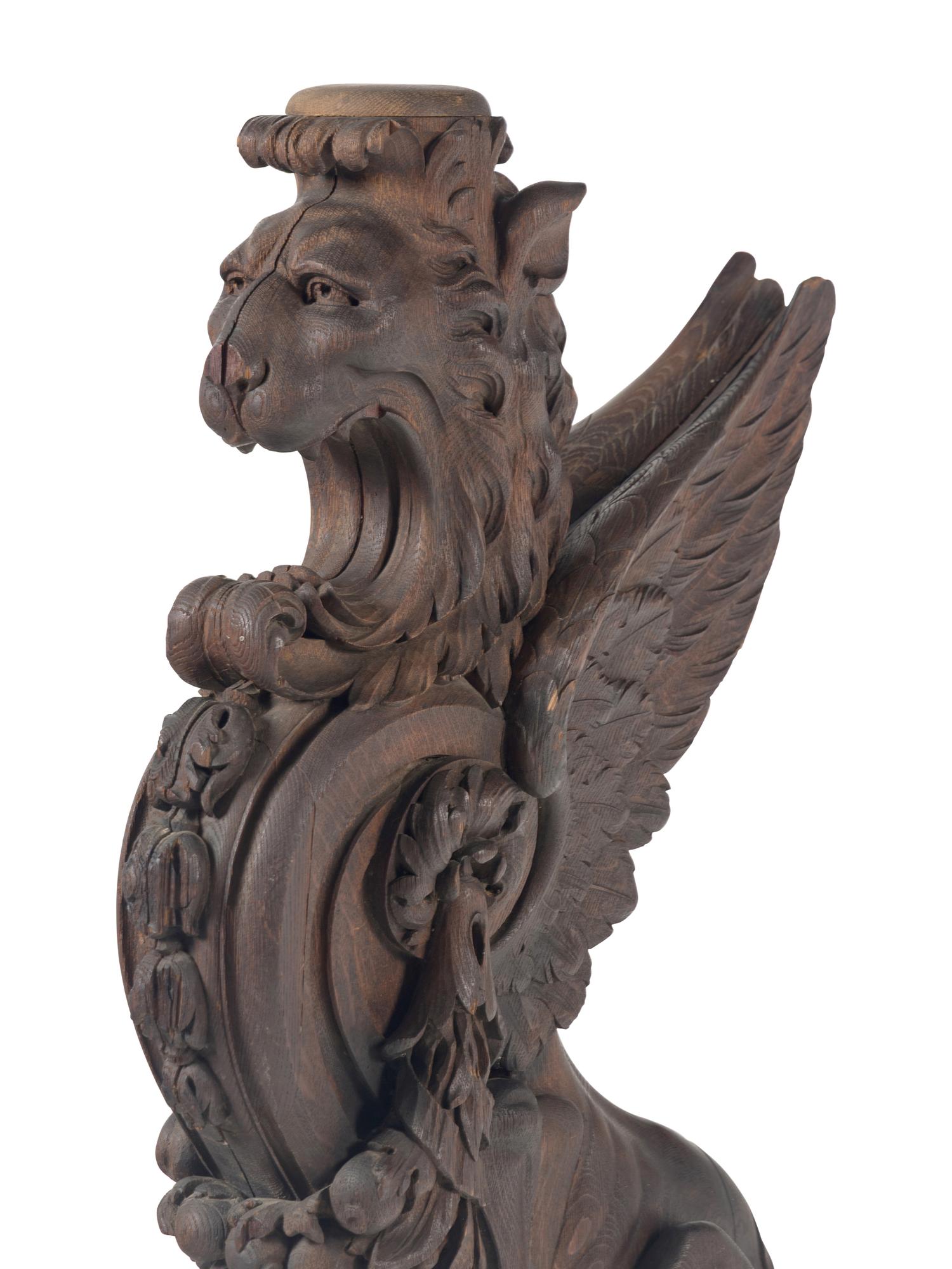 A Massive Carved Oak Griffin Newel Post
