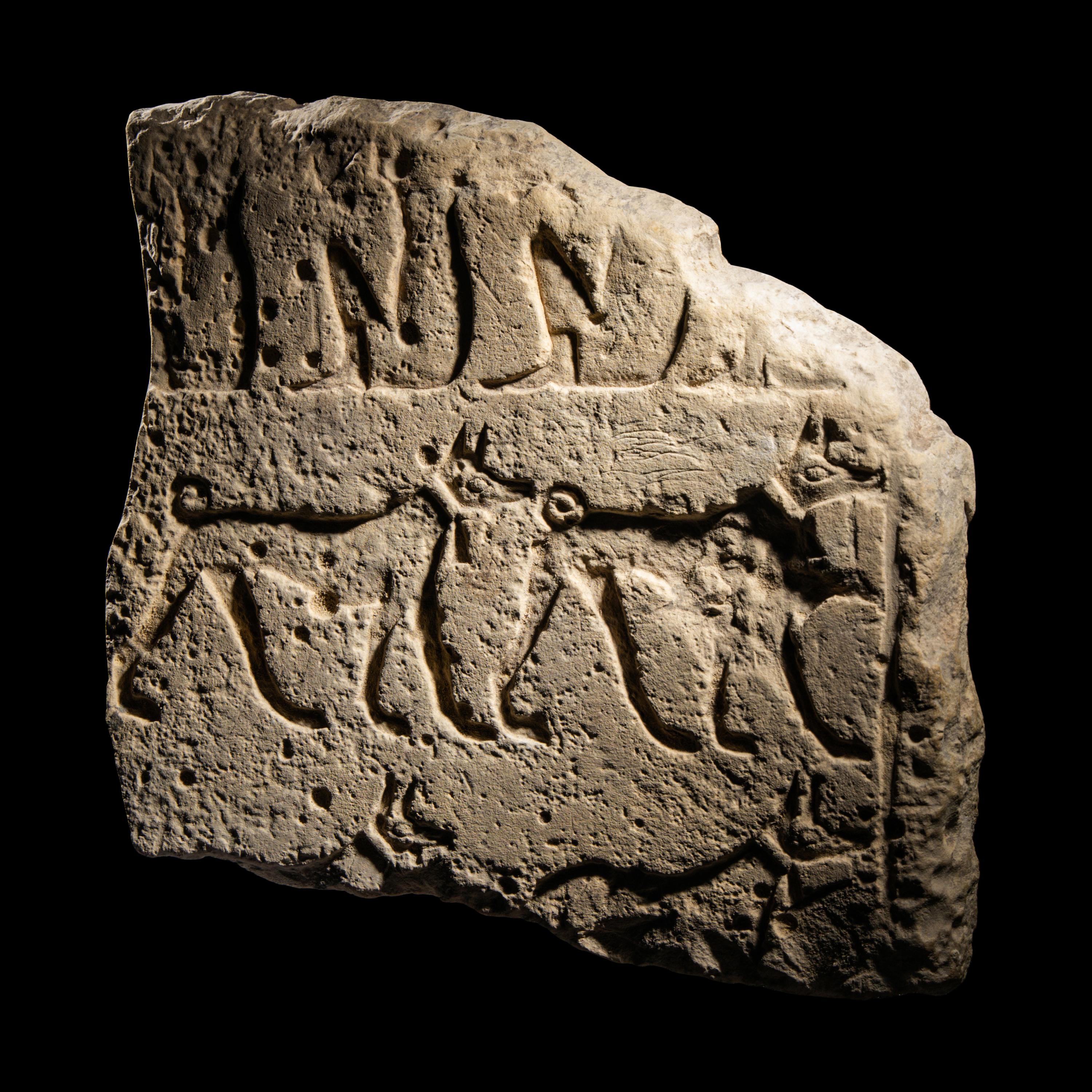An Egyptian Limestone Relief Fragment