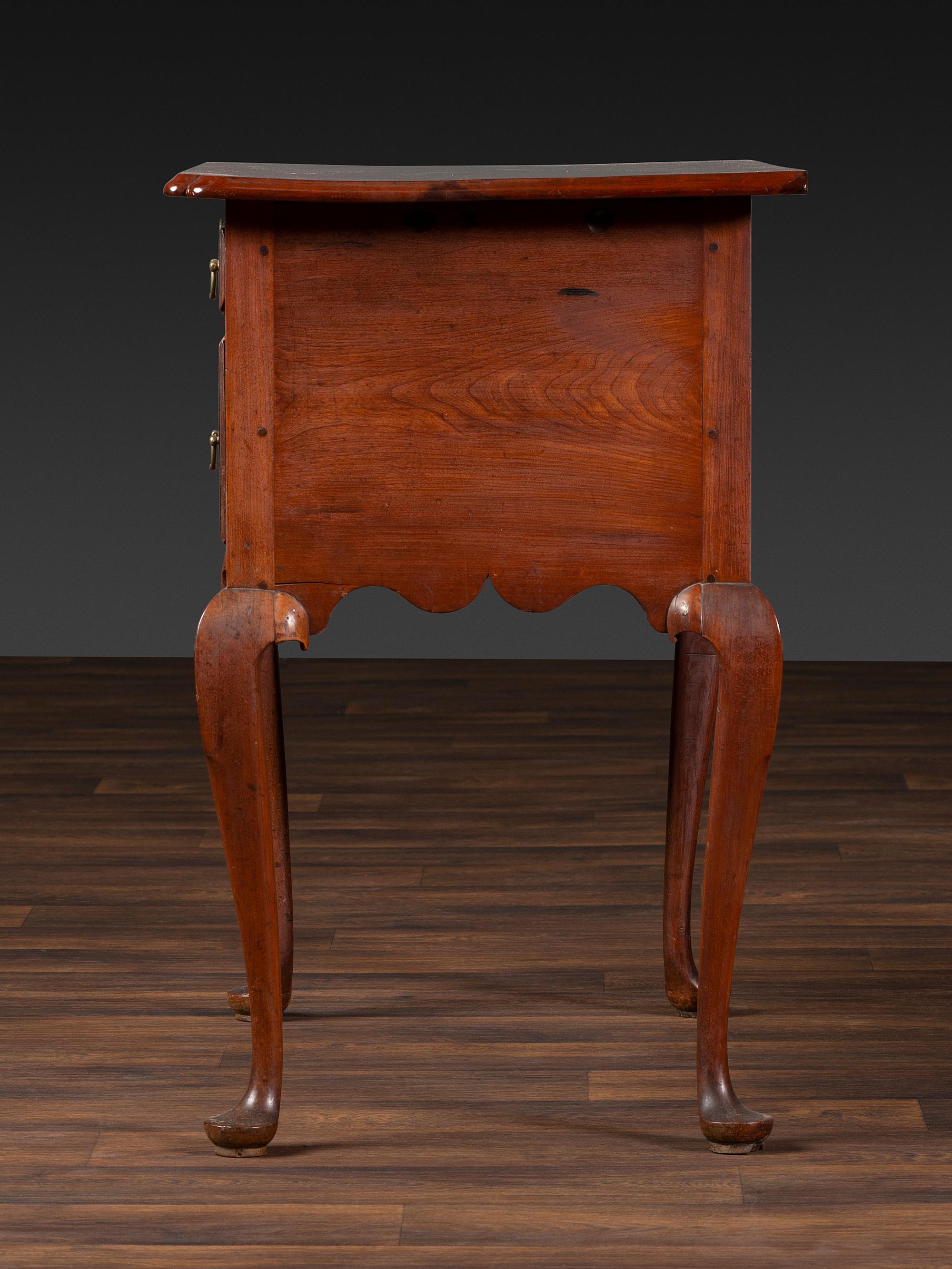 A Queen Anne Cherrywood and Maple Pad Foot Dressing Table