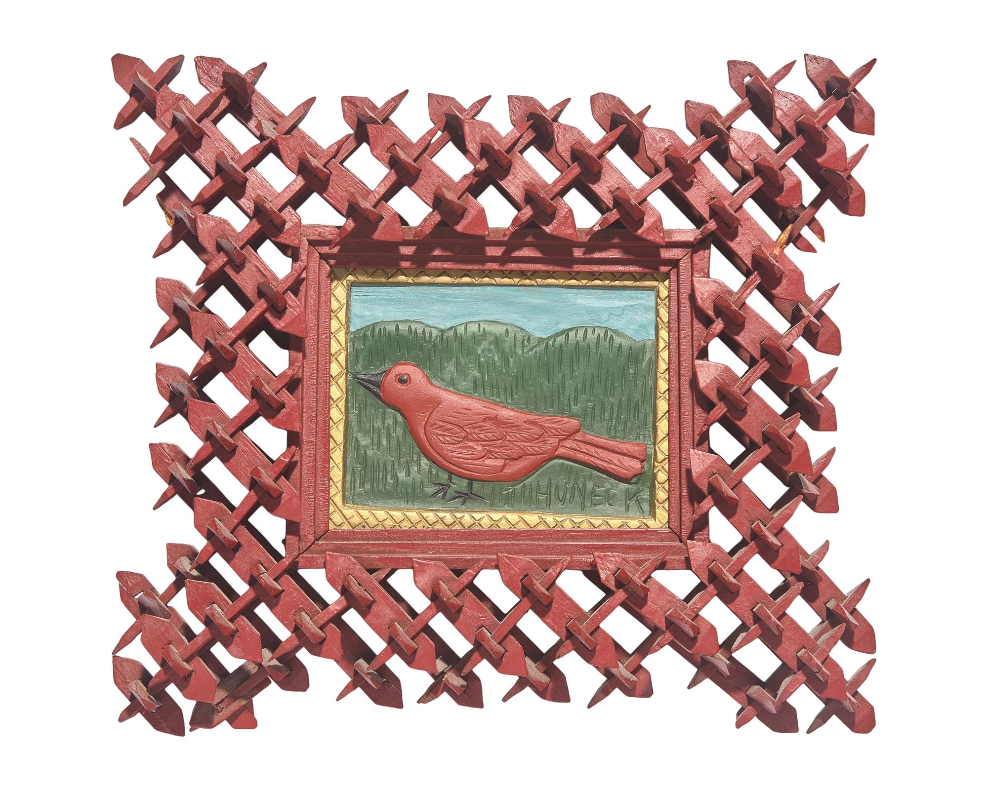 Stephen Huneck (1948-2010), A Carved and Painted Wood Plaque of a Bird in Painted Tramp Art Frame