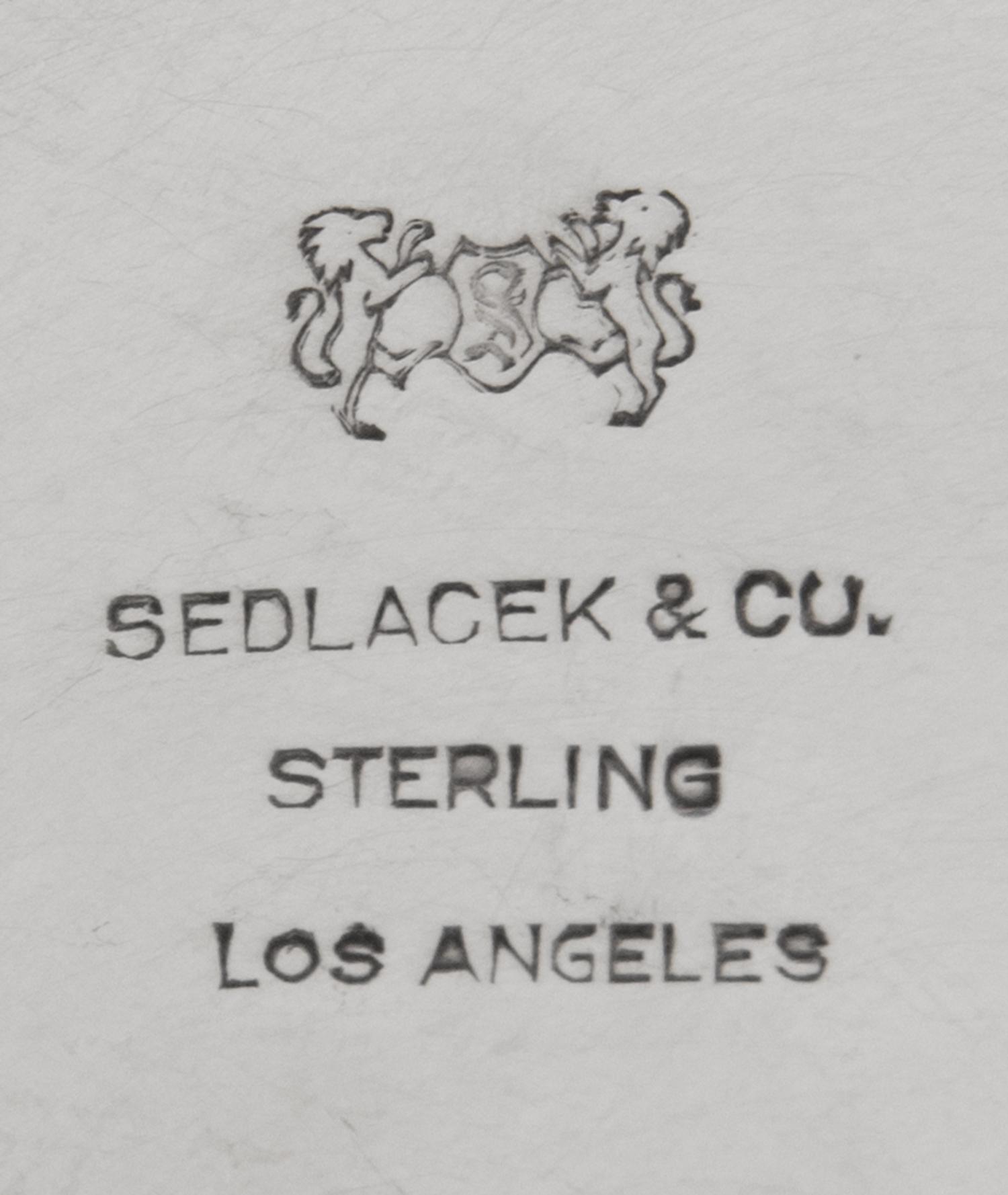An American Hammered Silver Trophy, Sedlacek & Co., Los Angeles, CA, 20th Century, the undulating rim over an ovoid basin, inscribed Op