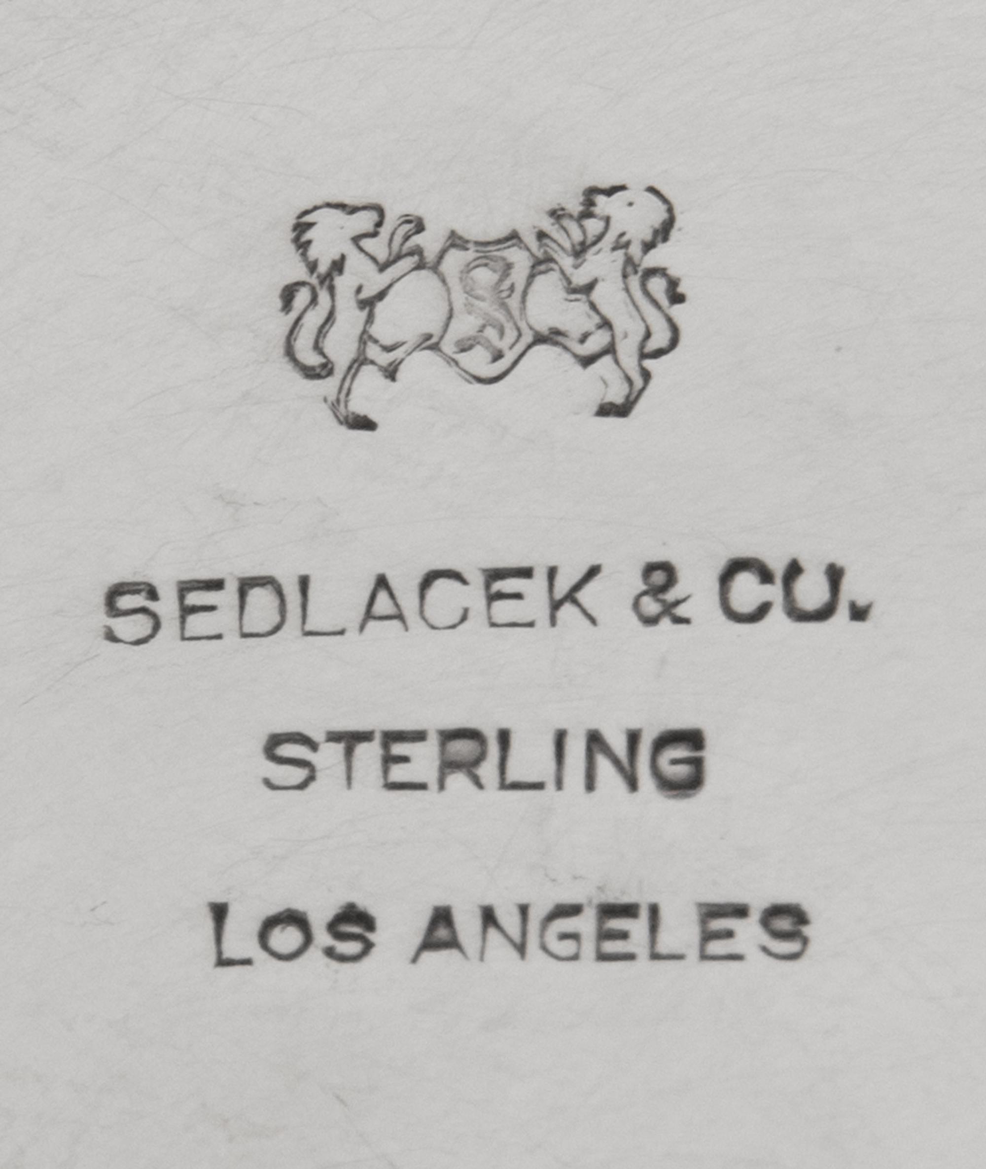 An American Hammered Silver Trophy, Sedlacek & Co., Los Angeles, CA, 20th Century, the undulating rim over an ovoid basin, inscribed Op