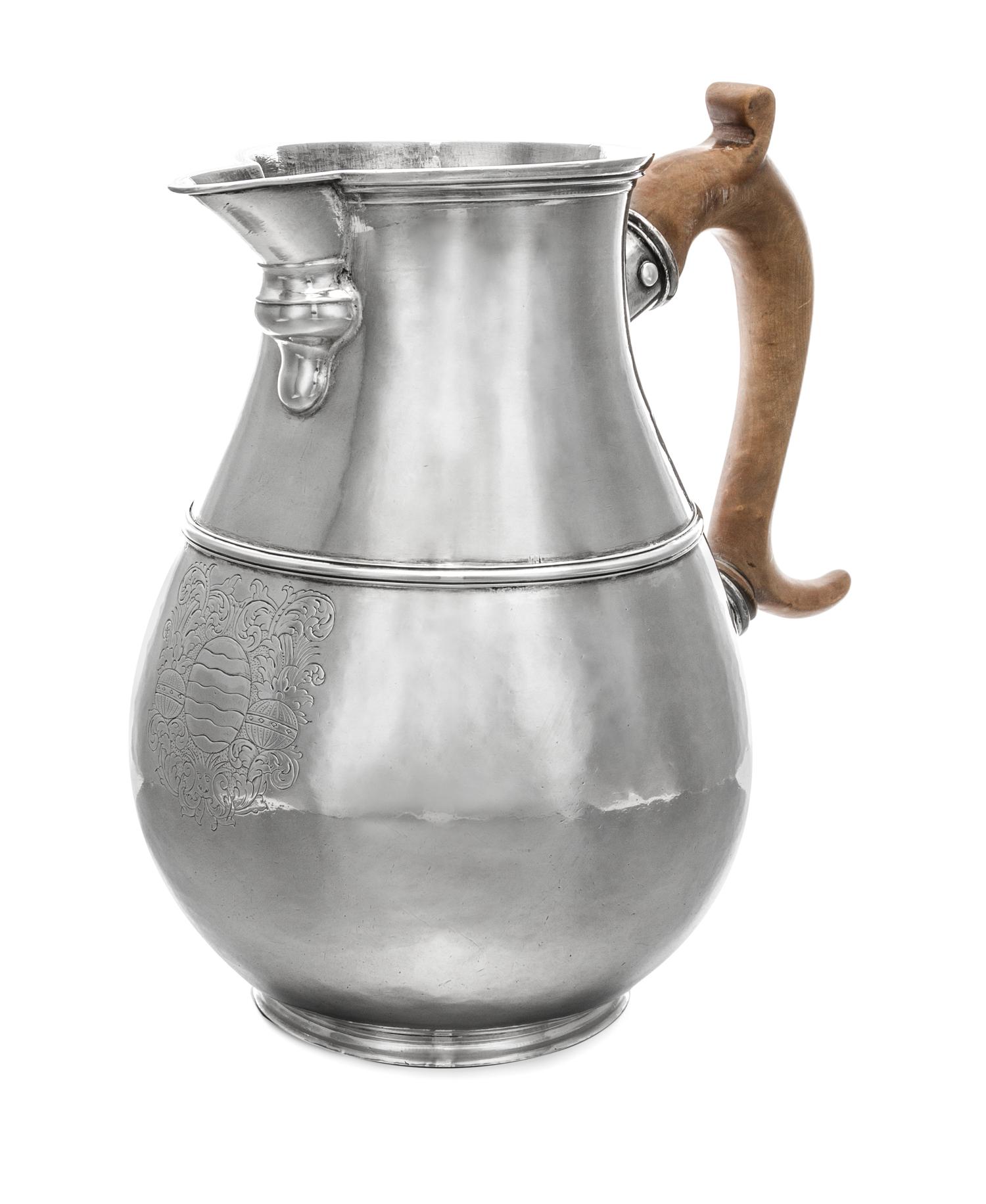 A George I Britannia Silver Pitcher, John Elston, Exeter, 1717, of baluster form with worked with a band to the body of the pitcher and