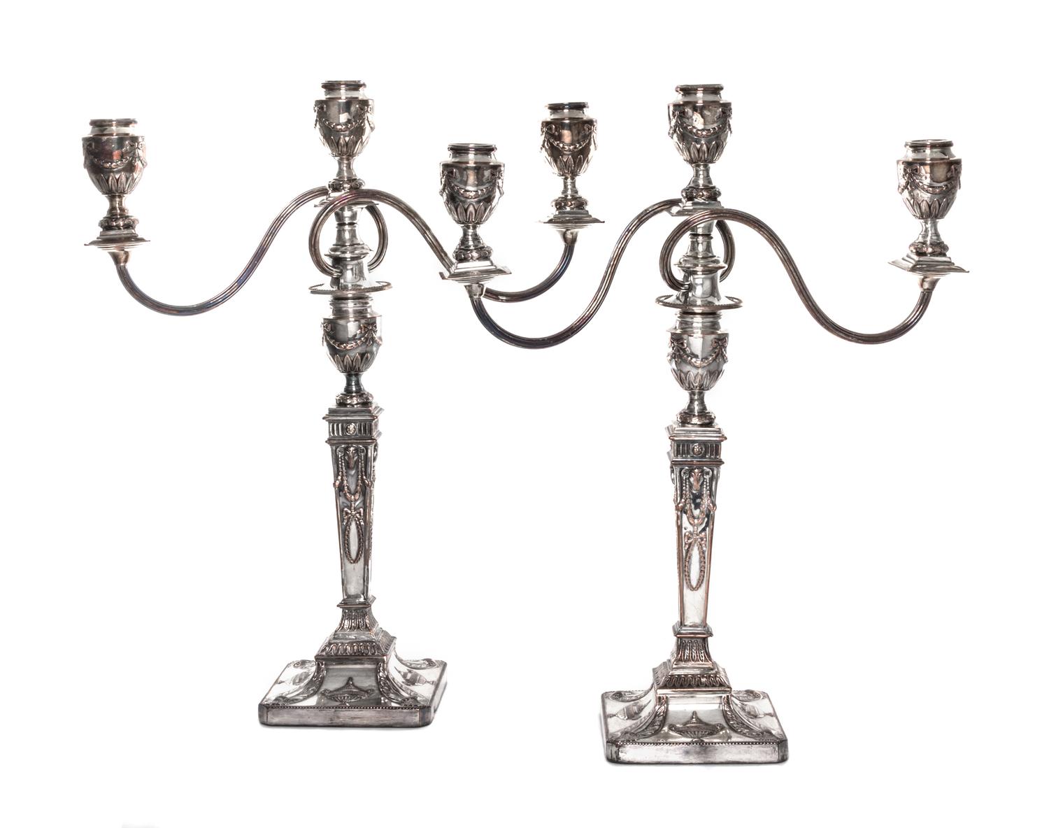 A Pair of English Neoclassical Silver-Plate Three-Light Candelabra, 19th/20th Century, each with a squared baluster form standard issui