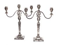 A Pair of English Neoclassical Silver-Plate Three-Light Candelabra, 19th/20th Century, each with a squared baluster form standard issui