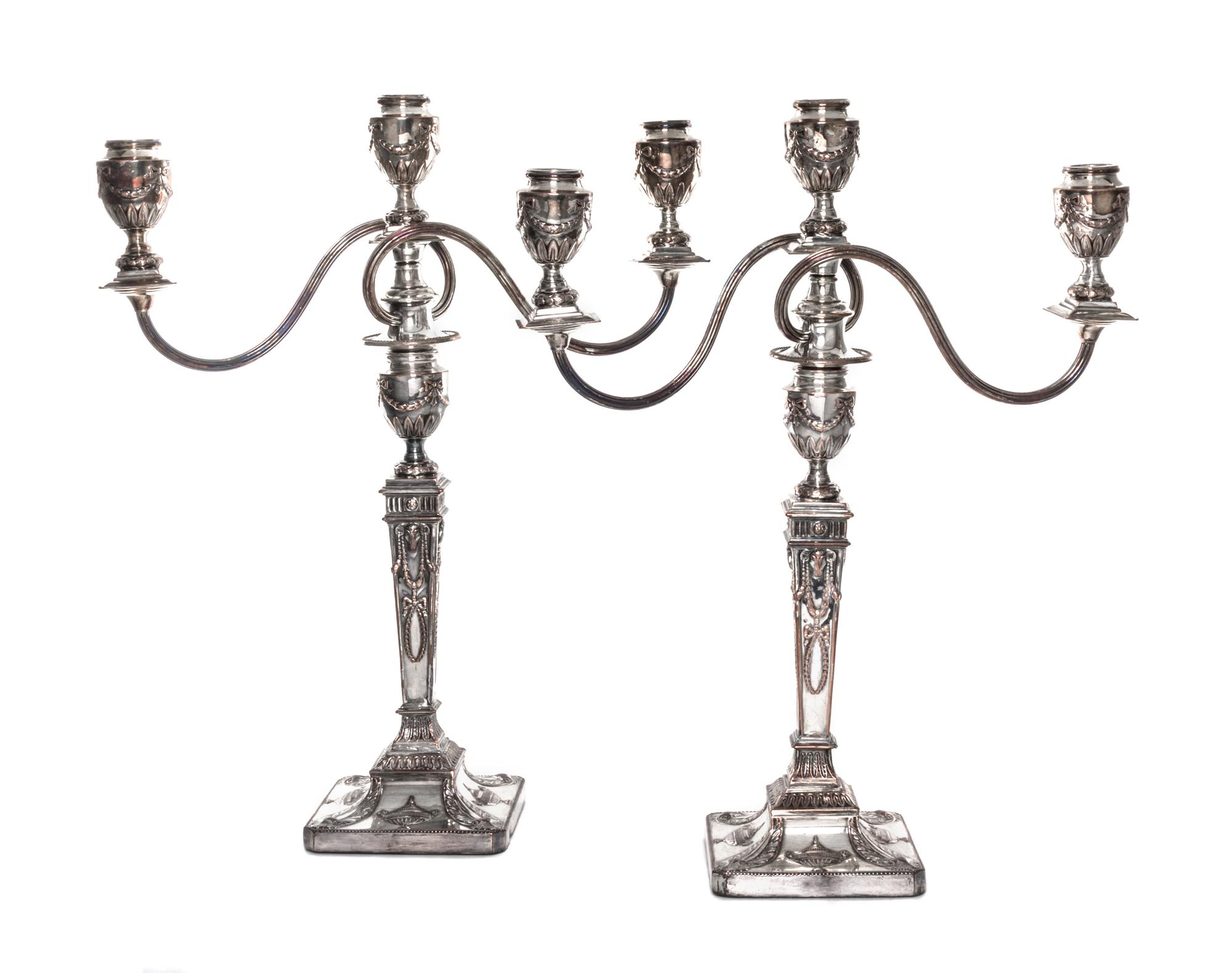 A Pair of English Neoclassical Silver-Plate Three-Light Candelabra, 19th/20th Century, each with a squared baluster form standard issui