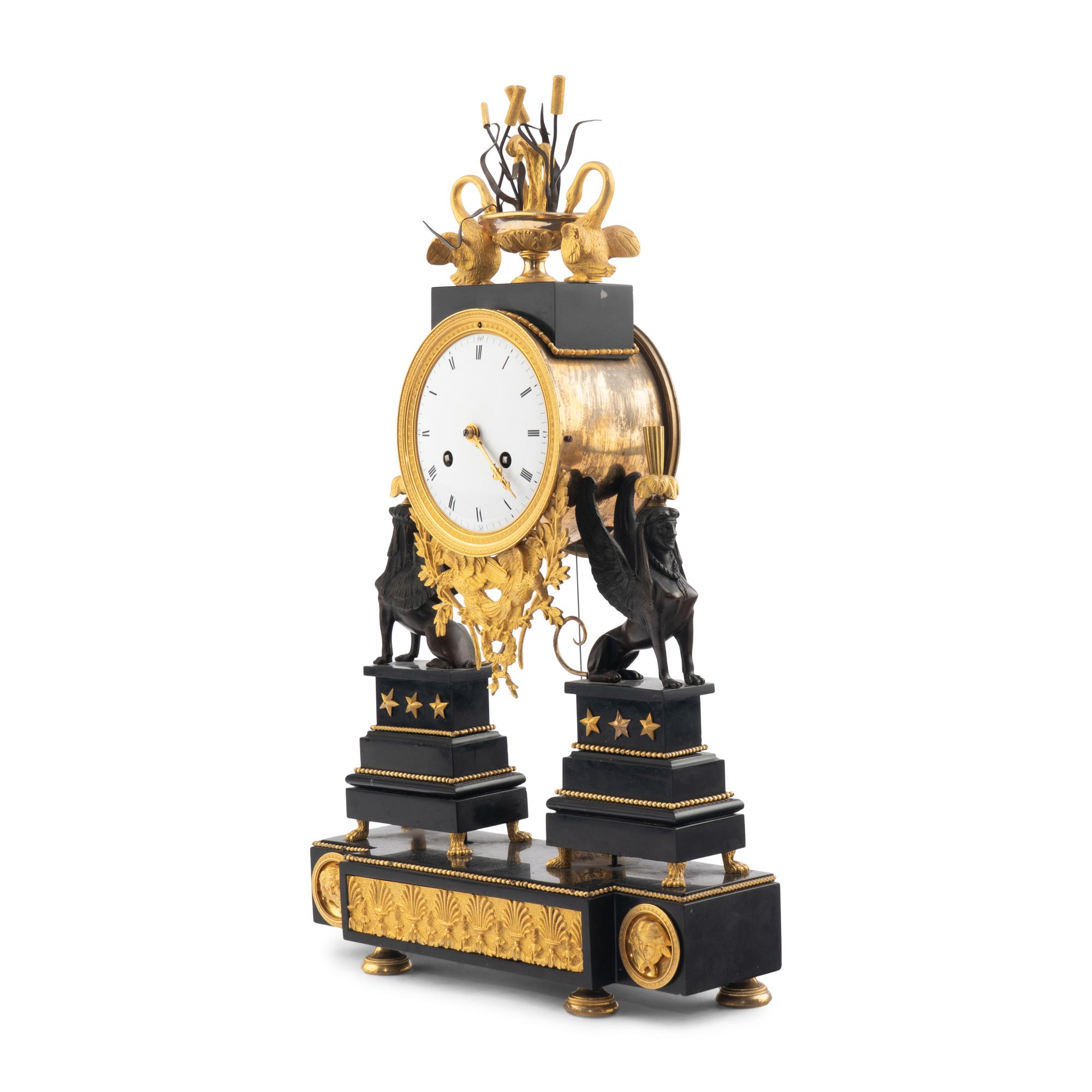 An Empire Ormolu, Black Granite and Patinated Bronze Mantel Clock