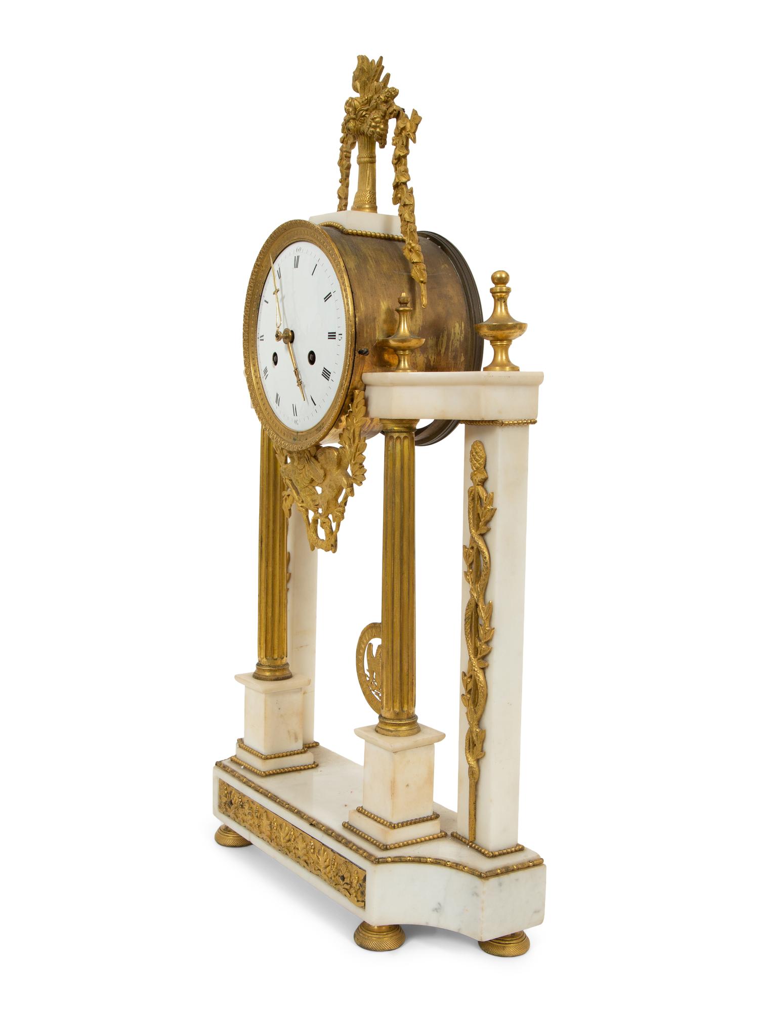 A French Gilt Bronze and White Marble Mantel Clock