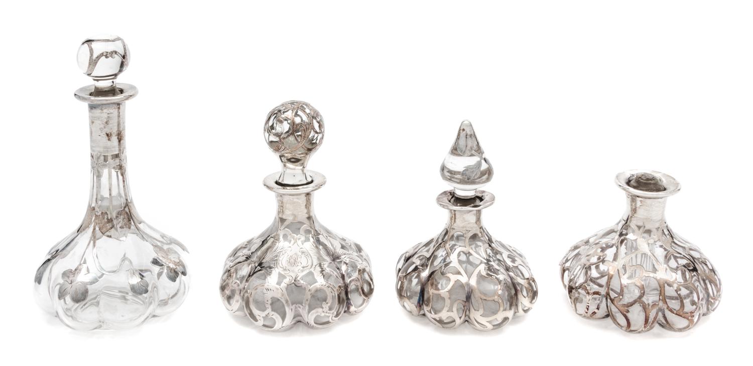 A Group of Four Silver Overlay Glass Perfume Bottles Height of tallest 6 1/2 inches.