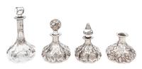 A Group of Four Silver Overlay Glass Perfume Bottles Height of tallest 6 1/2 inches.