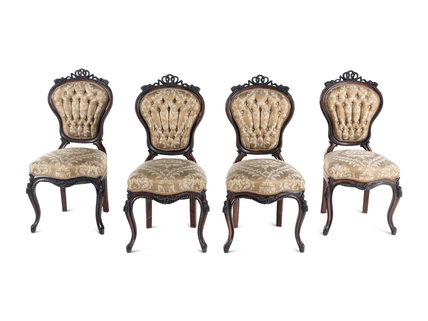 A Set of Four Rococo Revival Carved Balloon-Back Side Chairs