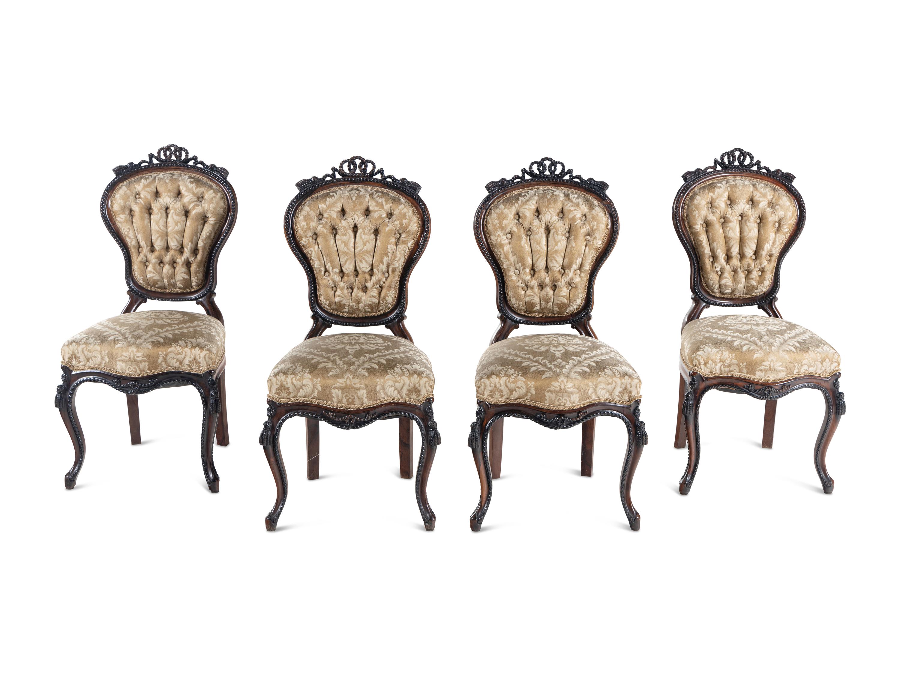 A Set of Four Rococo Revival Carved Balloon-Back Side Chairs