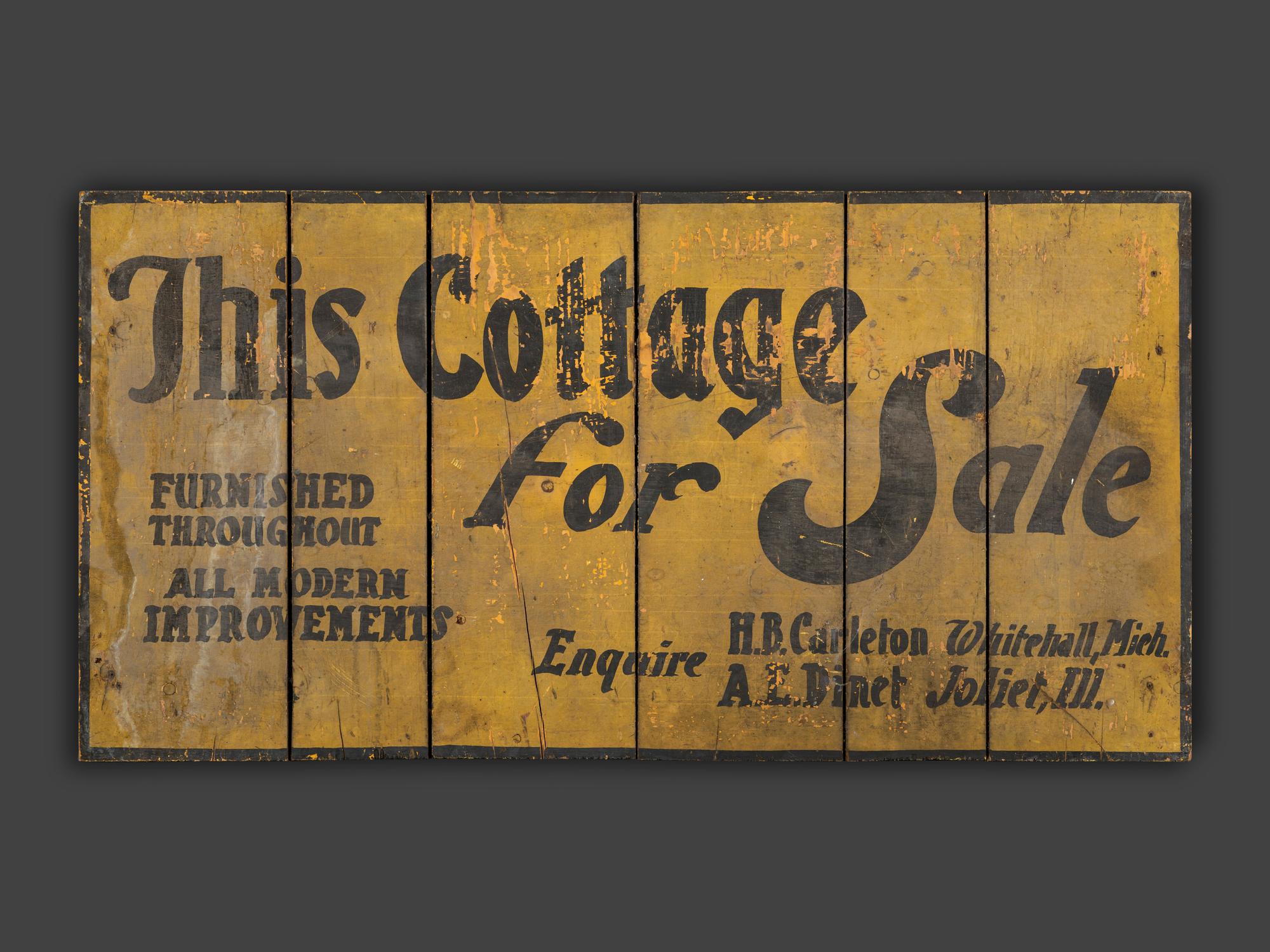 A Yellow Painted Wood 'This Cottage For Sale ' Sign
