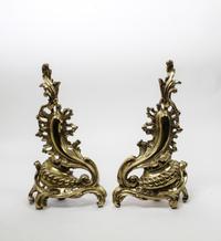 A Pair of Louis XV Style Brass Chenets Height 17 inches. — 20TH CENTURY