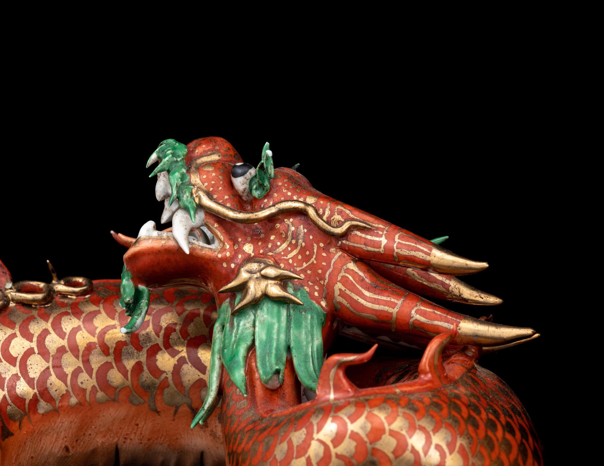 A Pair of Chinese Coral-Ground Gilt and Green Enameled Porcelain Dragons