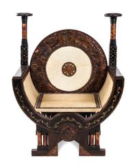 An Italian Carved and Inlaid Throne Chair Height 43 inches. — CIRCA 1900, ATTRIBUTED TO CARLO BUGATTI