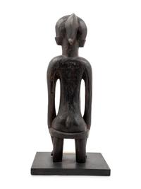 A Senufo Style Carved Wood Figure