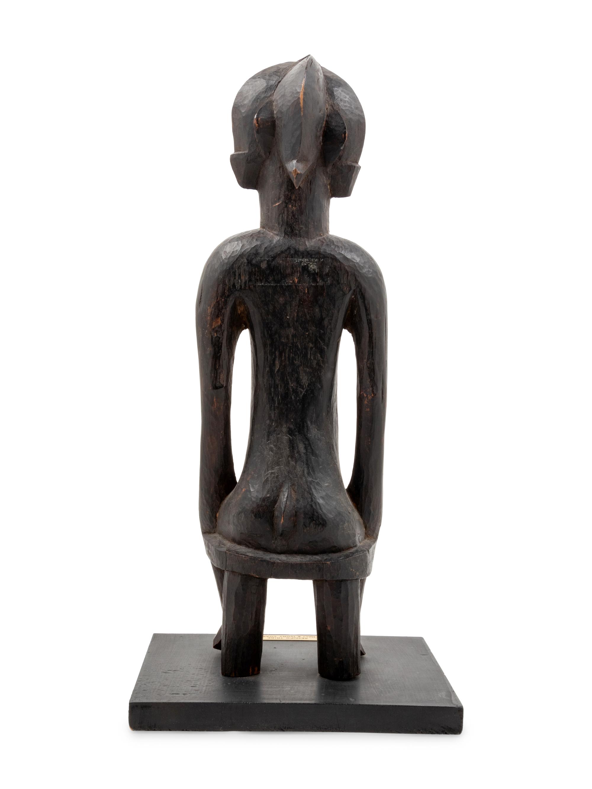 A Senufo Style Carved Wood Figure